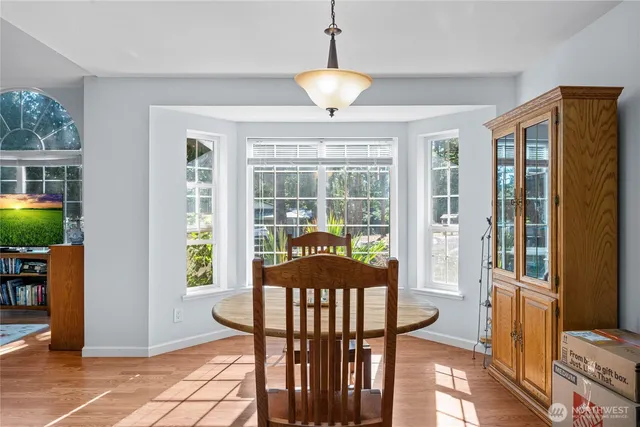 a view of a livingroom with furniture wooden floor a chandelier