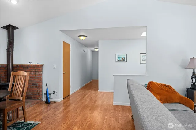 a view of living room with furniture and wooden floor