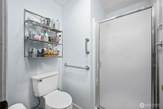 a white toilet sitting next to a bathroom sink