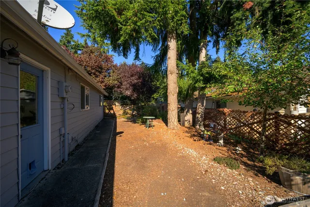 a view of a house with a tree