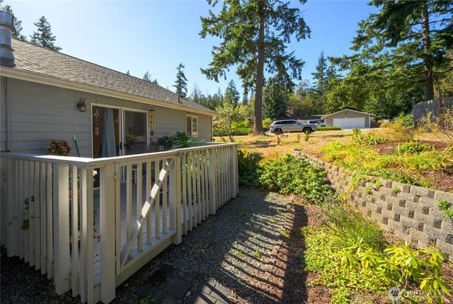 a view of a house with wooden fence