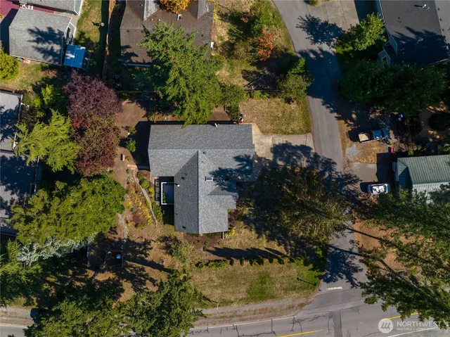 an aerial view of house with yard