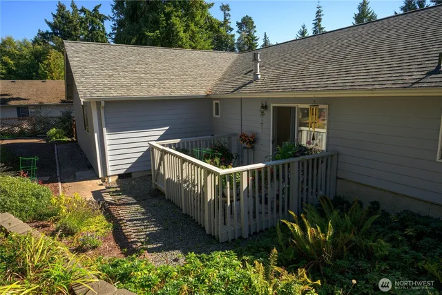 a view of a house with wooden fence