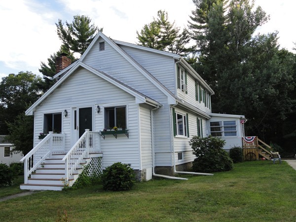 431 Spring Street Hanson, MA 02341 - Photo 1 of 21 a front view of a house with a yard