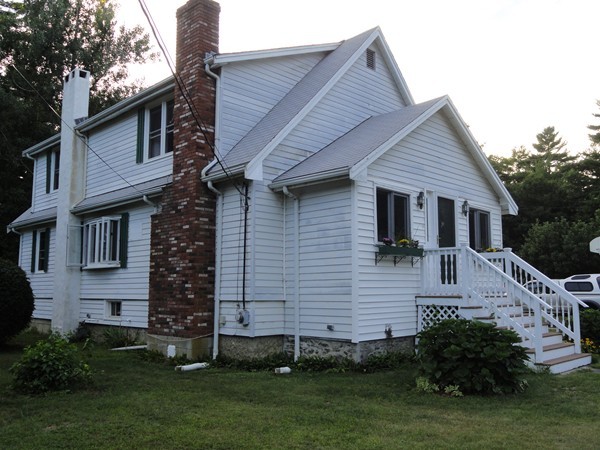 431 Spring Street Hanson, MA 02341 - Photo 2 of 21 a view of a house with a yard