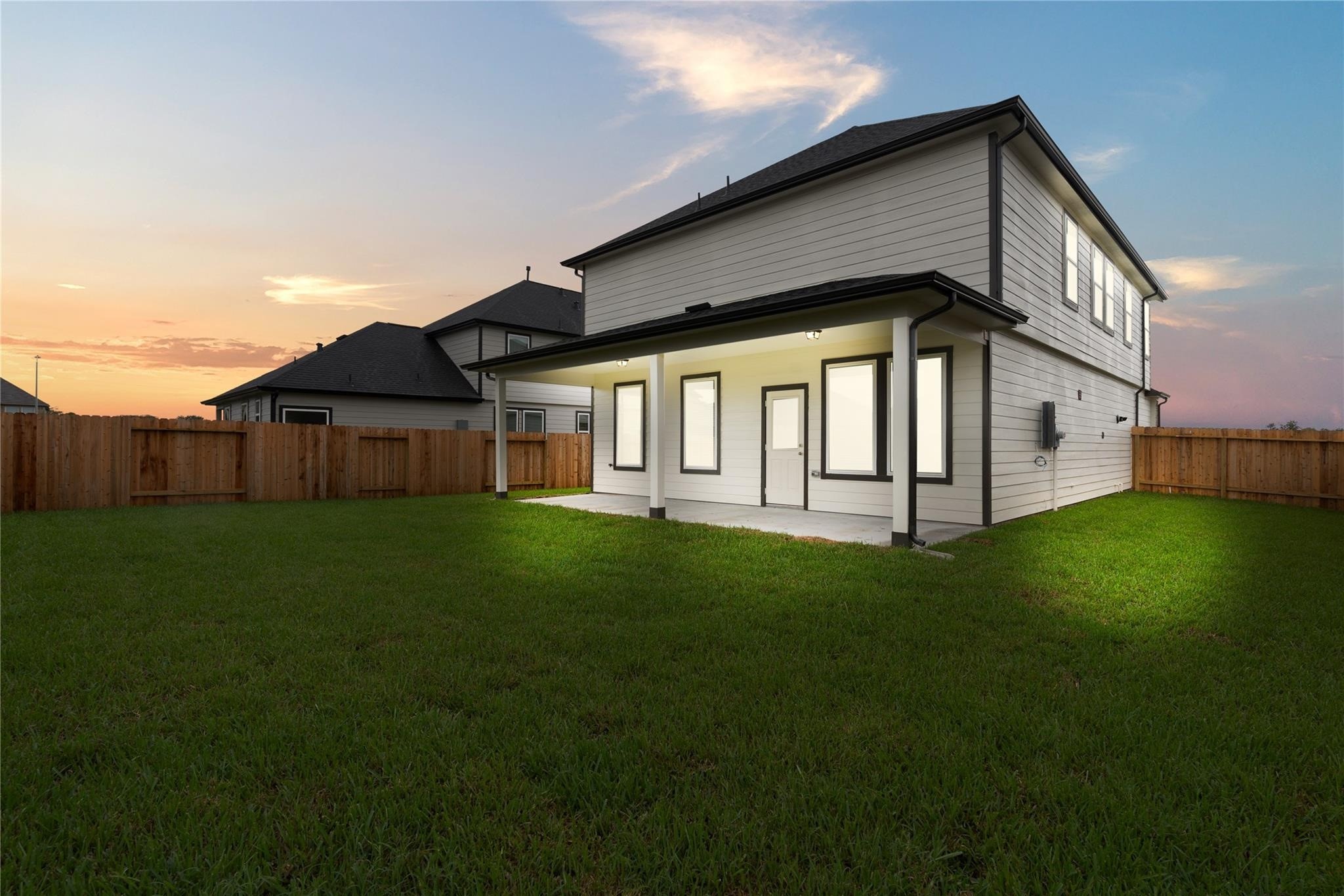 2639 Finley Lane Rosenberg, TX 77471 - Photo 13 of 18 Modern two-story home with a spacious fenced backyard. Features a covered patio perfect for outdoor relaxation. Ideal for privacy and entertainment.