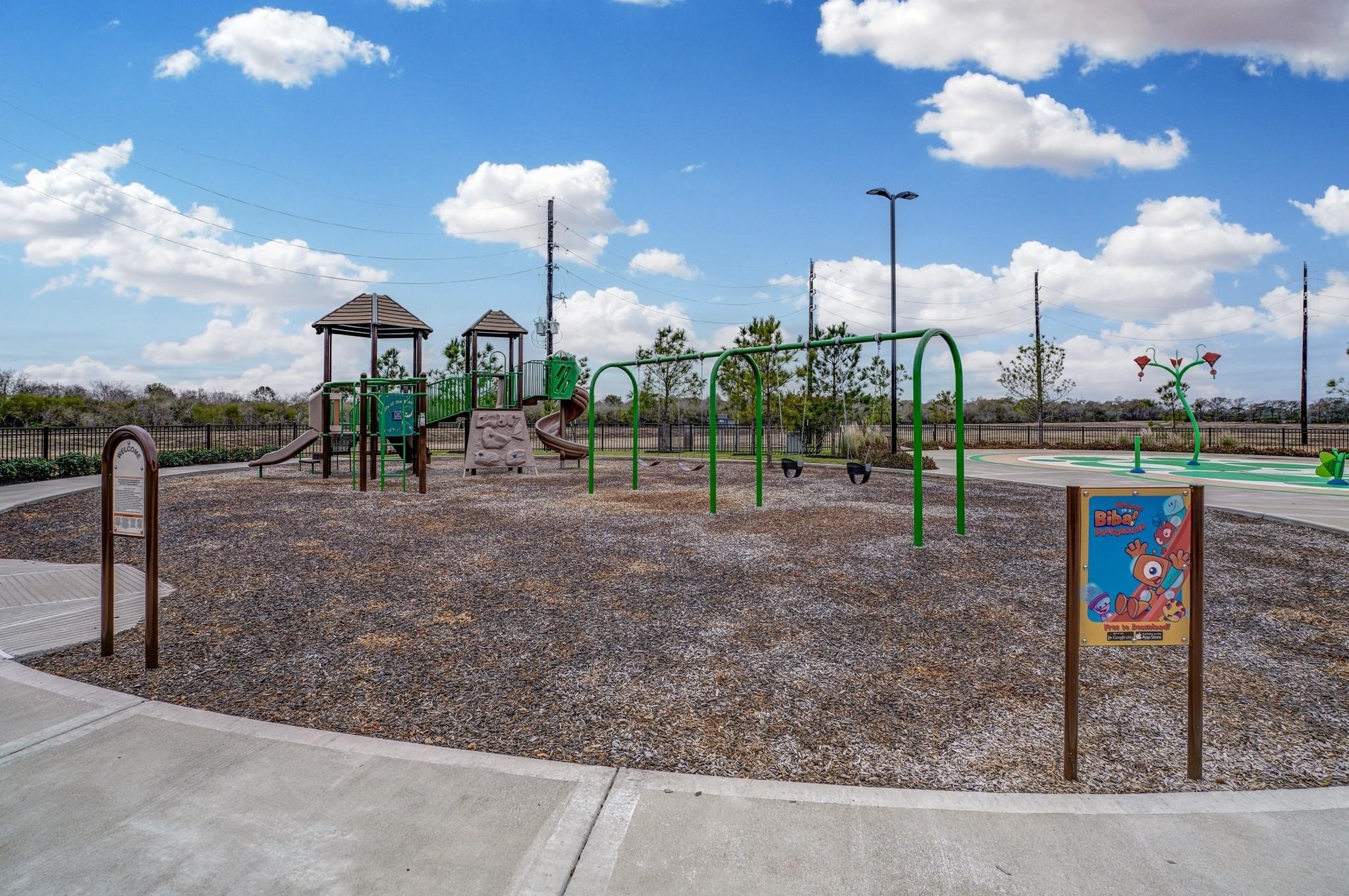 2639 Finley Lane Rosenberg, TX 77471 - Photo 16 of 18 Family-friendly community park featuring a playground with slides, swings, and a play area. Ideal for children and outdoor activities, surrounded by a safe, well-maintained environment.