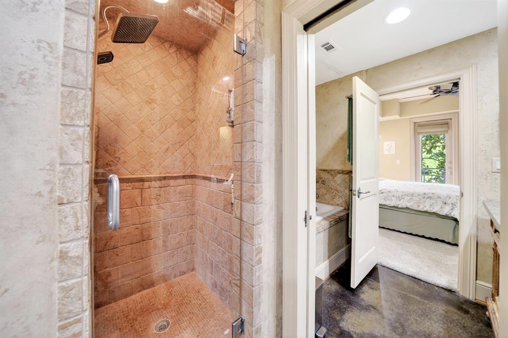 5055 Addison Circle, Unit 426 Addison, TX 75001 - Photo 24 of 38 a en suite bathroom with a shower