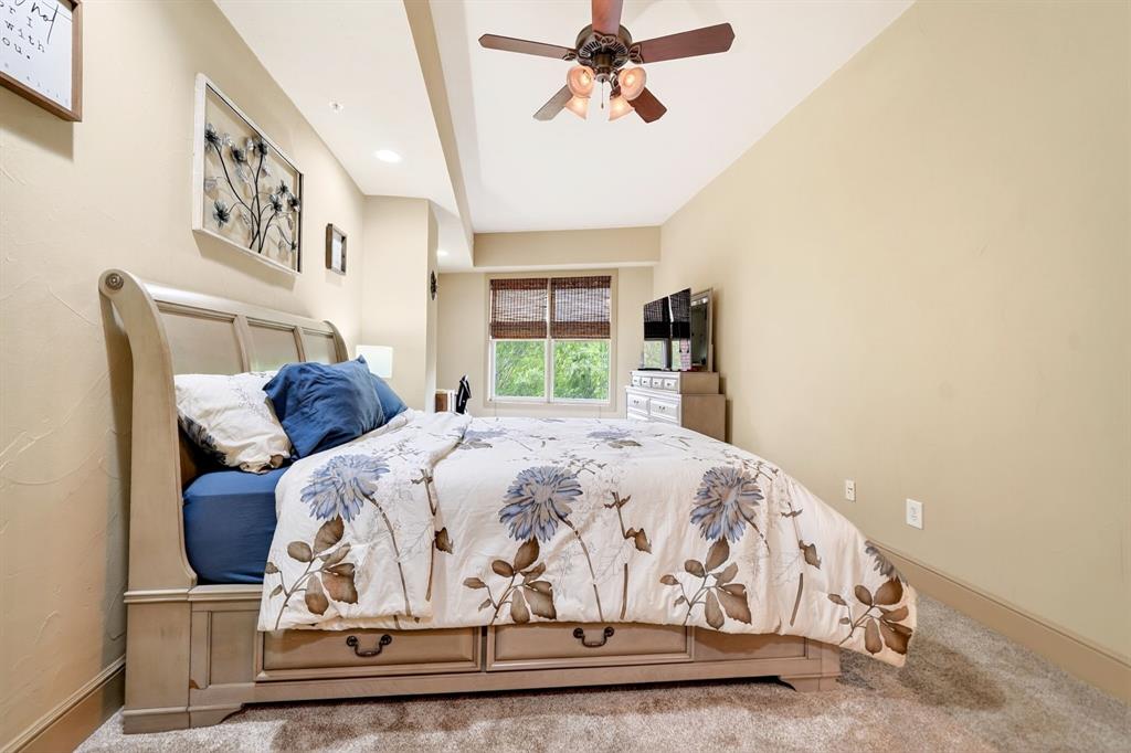5055 Addison Circle, Unit 426 Addison, TX 75001 - Photo 30 of 38 a bedroom with a bed and window