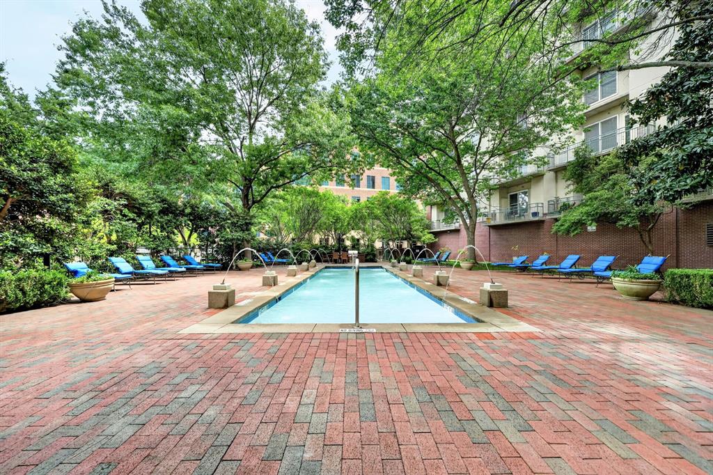 5055 Addison Circle, Unit 426 Addison, TX 75001 - Photo 32 of 38 a view of a swimming pool with a patio