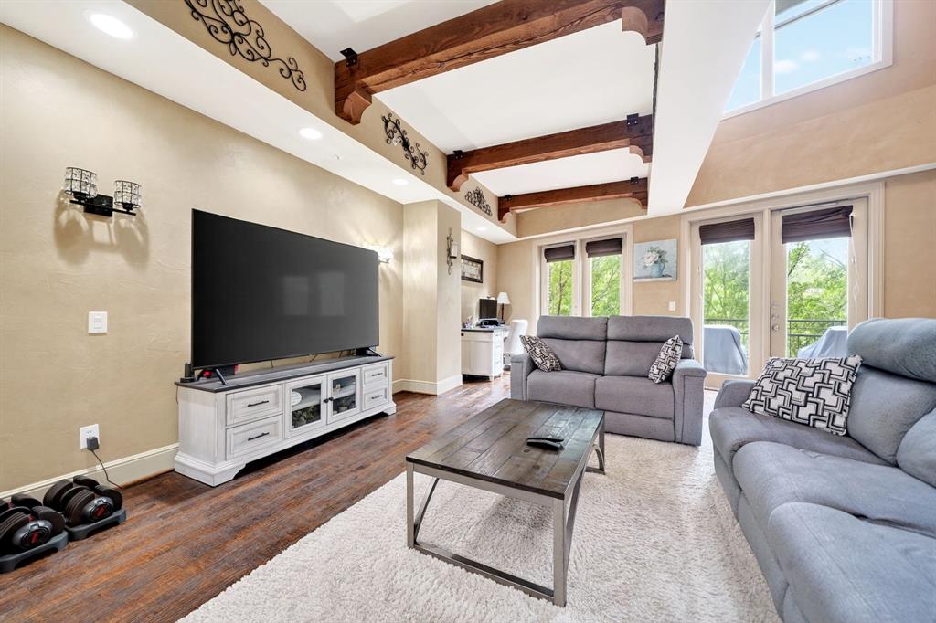 5055 Addison Circle, Unit 426 Addison, TX 75001 - Photo 5 of 38 a living room with furniture and a flat screen tv