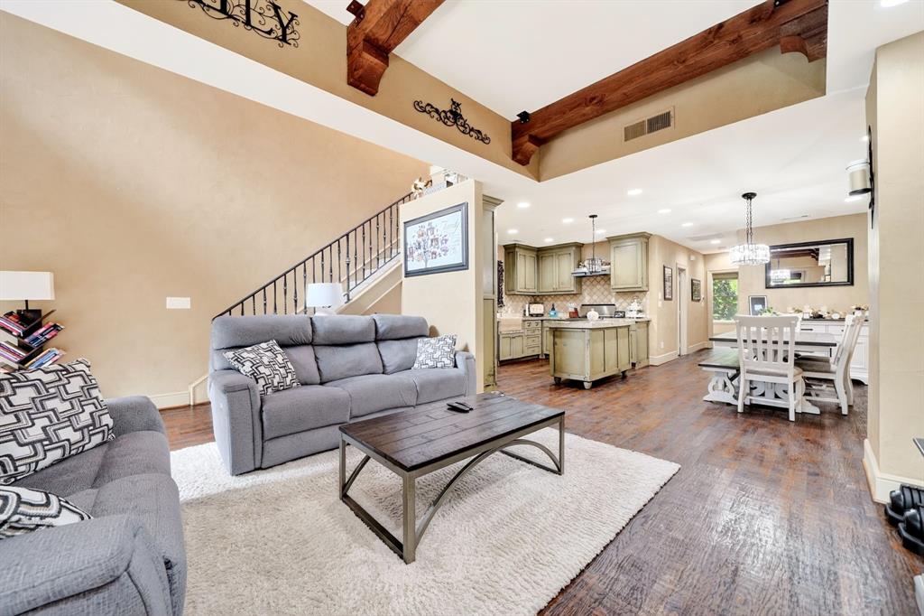 5055 Addison Circle, Unit 426 Addison, TX 75001 - Photo 8 of 38 a living room with furniture and kitchen view