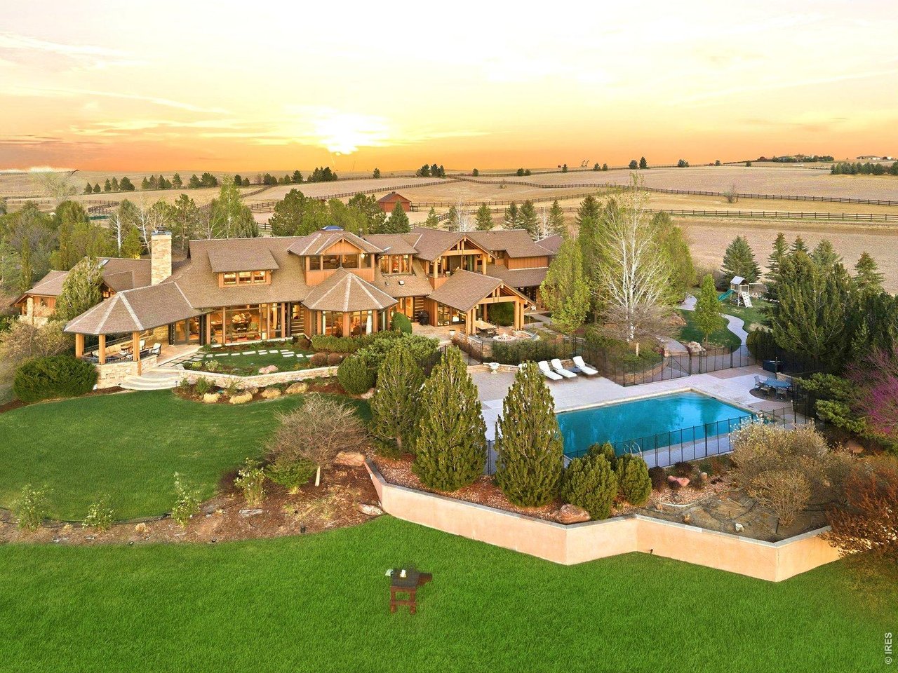 15383 East County Line Road Berthoud, CO 80513 - Photo 47 of 47 a view of a lake with a yard and mountain view