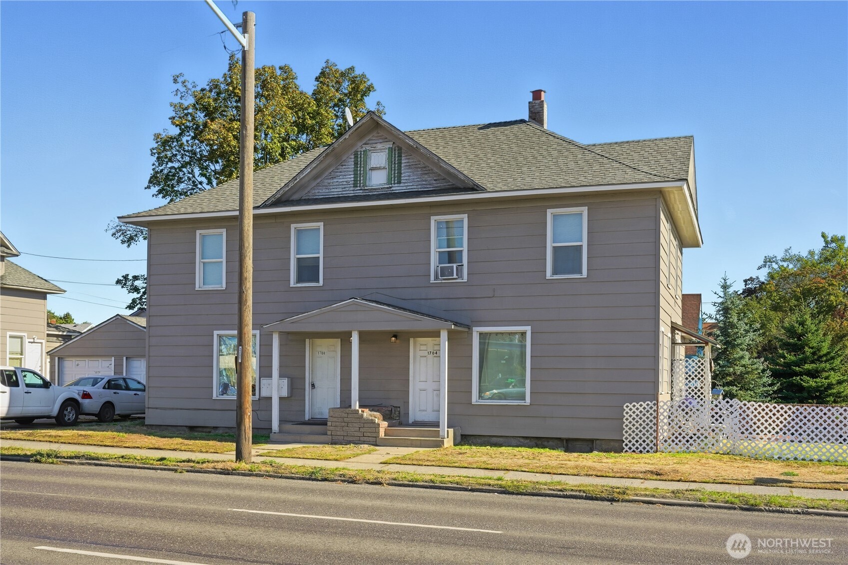 1704 North Ash Street Spokane, WA 99205 - Photo 17 of 23 a front view of a house with a yard