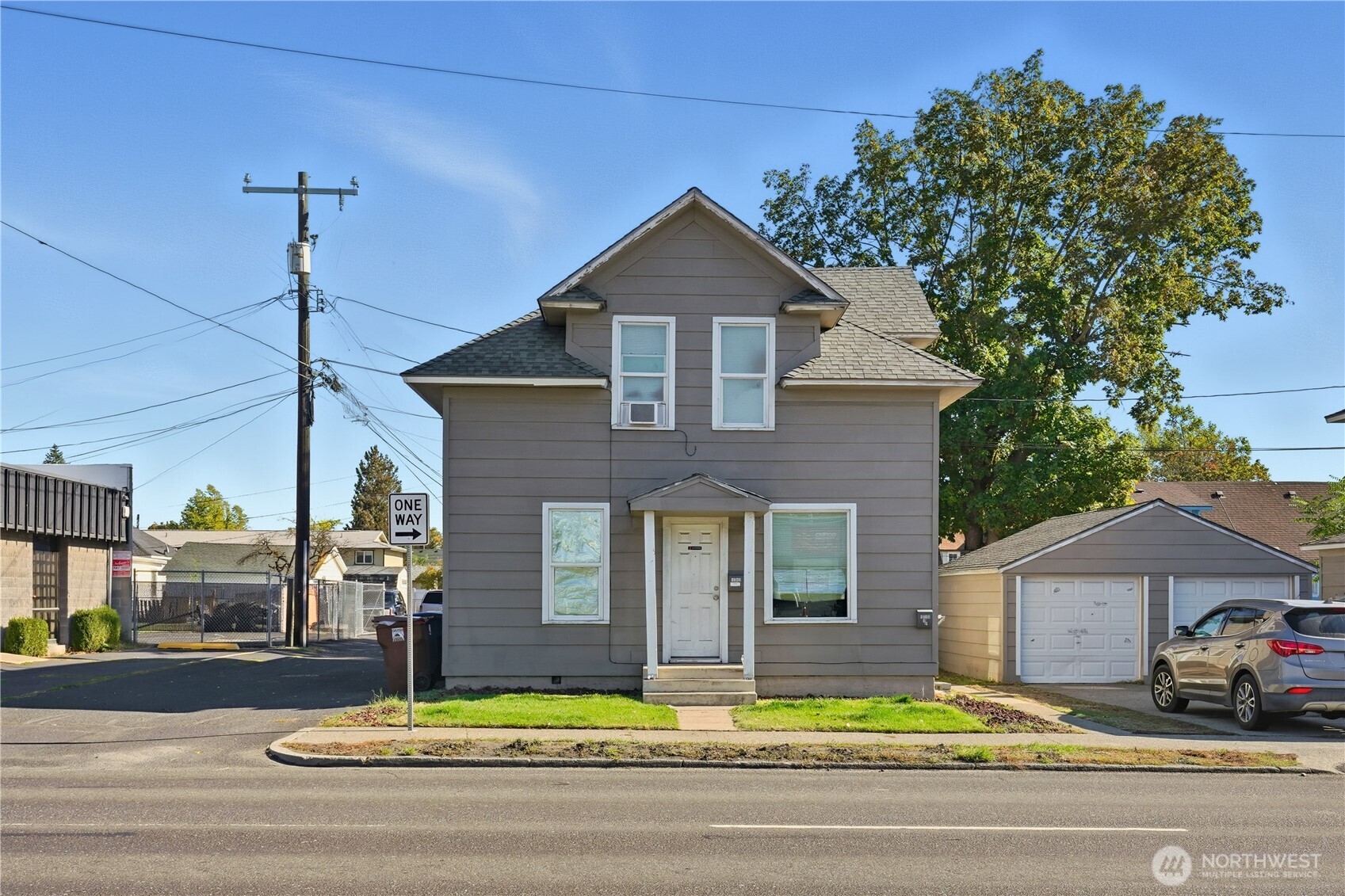 1704 North Ash Street Spokane, WA 99205 - Photo 2 of 23 a front view of a house with a yard table and chairs