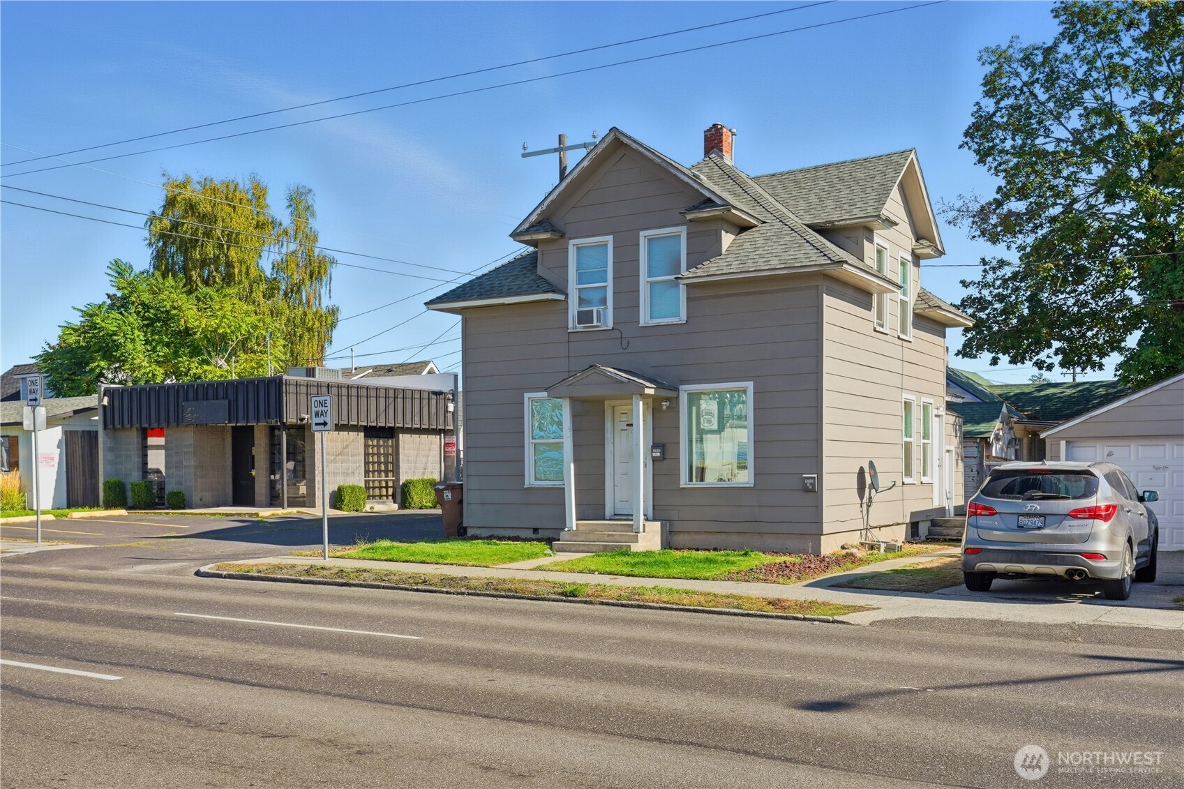 1704 North Ash Street Spokane, WA 99205 - Photo 3 of 23 a front view of a house with a garden