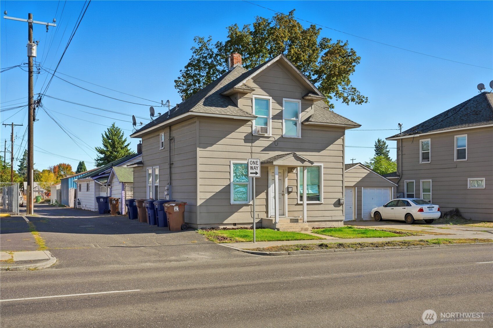 1704 North Ash Street Spokane, WA 99205 - Photo 4 of 23 a front view of a house with a yard