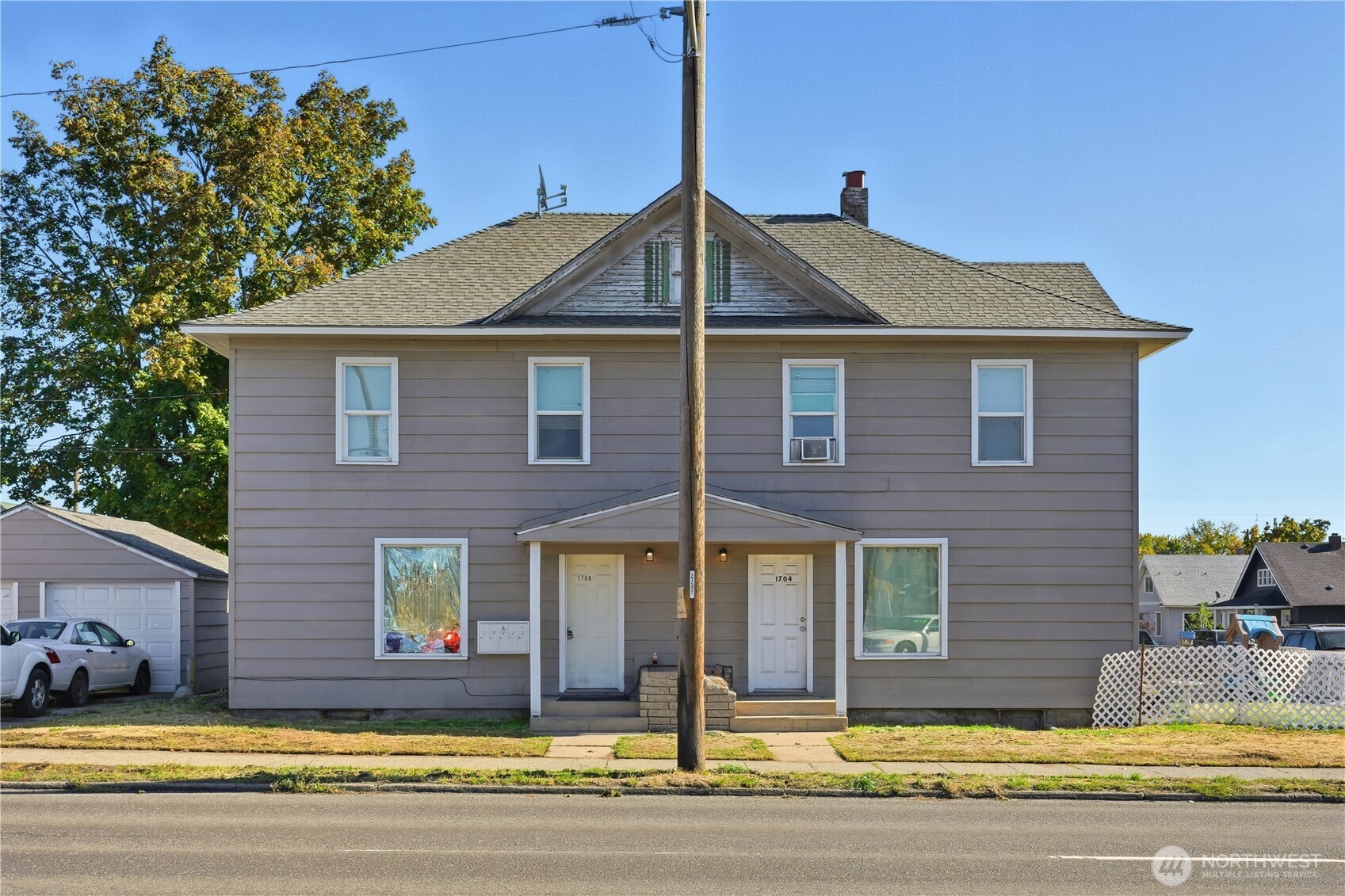 1704 North Ash Street Spokane, WA 99205 - Photo 5 of 23 a front view of a house with a yard