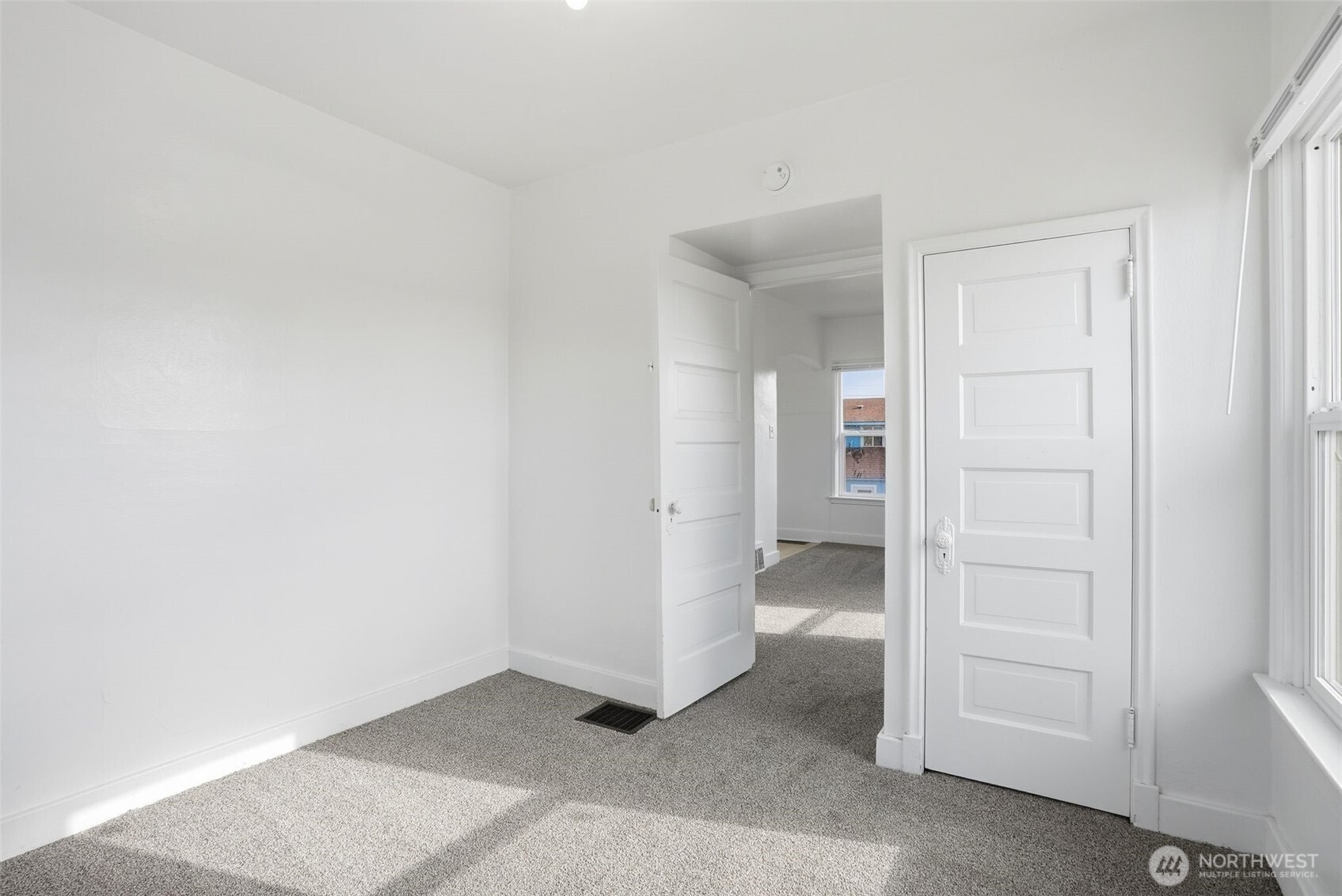 1704 North Ash Street Spokane, WA 99205 - Photo 9 of 23 an empty room with a hallway and closet