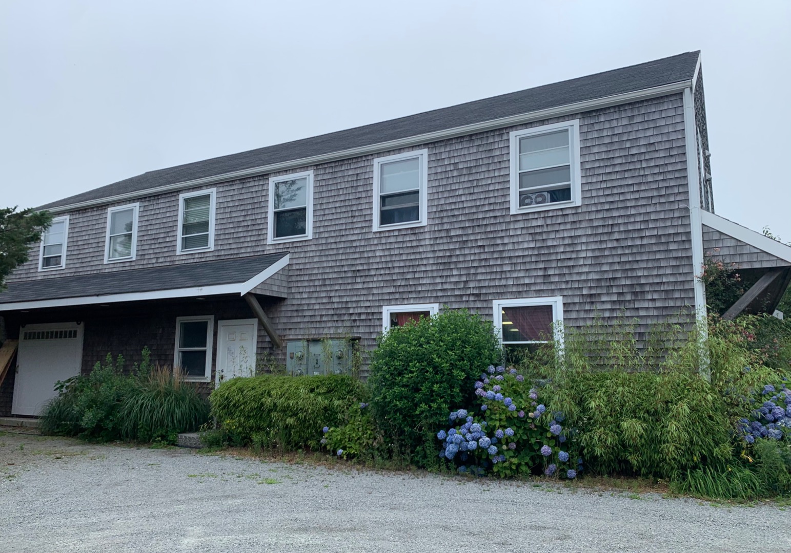 5 Salros Road Nantucket, MA 02554 - Photo 1 of 24 a front view of a house with garden