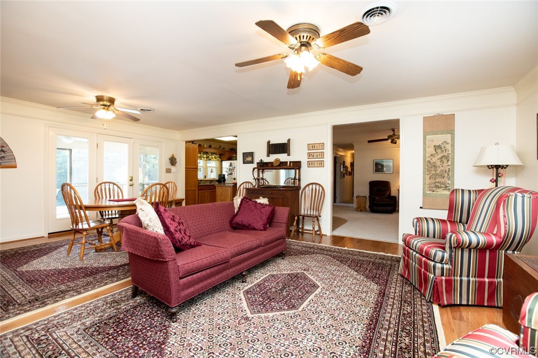 3384 Rice Creek Road Farmville, VA 23901 - Photo 11 of 50 a living room with furniture ceiling fan and a rug