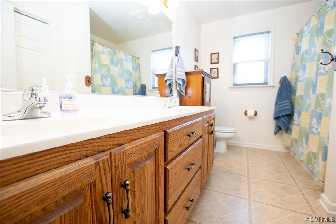 3384 Rice Creek Road Farmville, VA 23901 - Photo 21 of 50 a bathroom with a sink a mirror and a shower