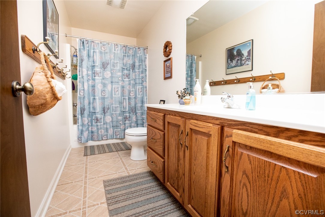 3384 Rice Creek Road Farmville, VA 23901 - Photo 27 of 50 a bathroom with a sink a toilet a mirror and shower
