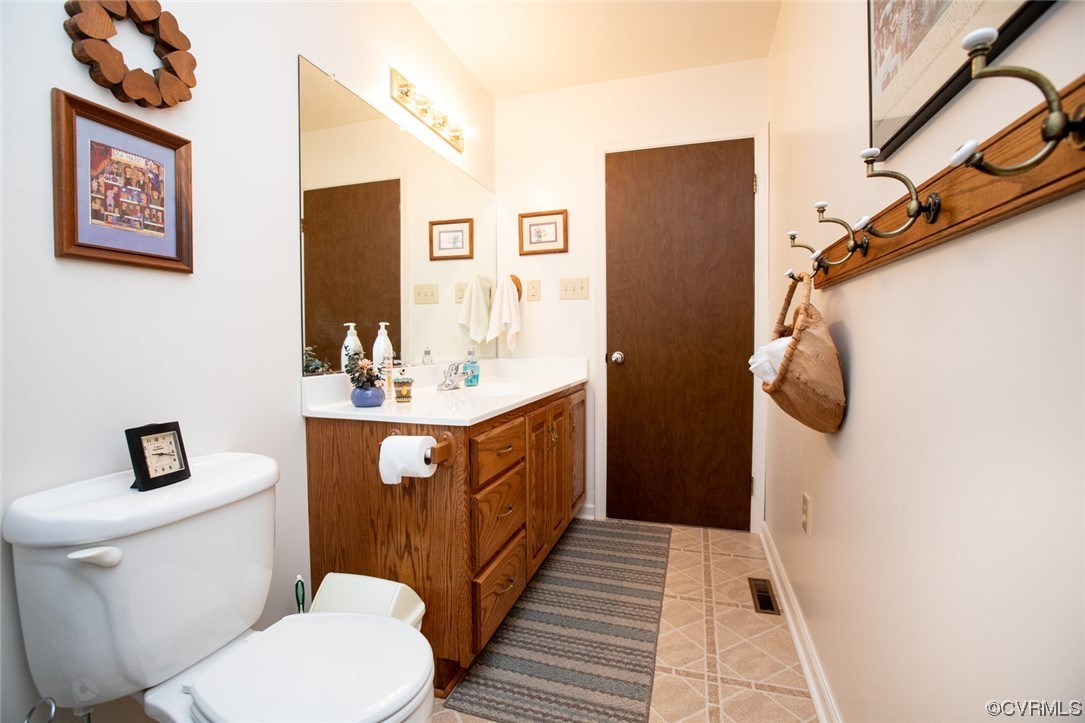 3384 Rice Creek Road Farmville, VA 23901 - Photo 28 of 50 a bathroom with a sink a toilet a mirror and shower