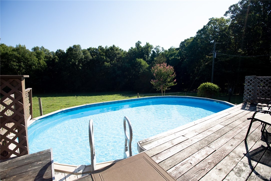 3384 Rice Creek Road Farmville, VA 23901 - Photo 36 of 50 a view of a swimming pool with a lounge chair