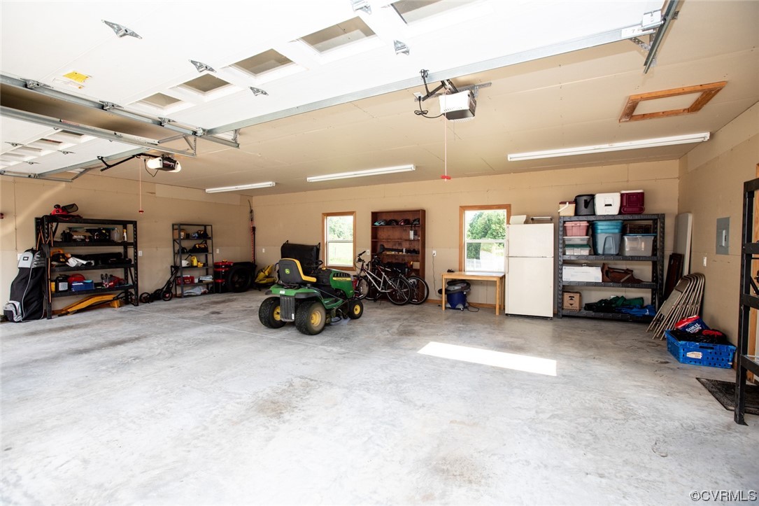 3384 Rice Creek Road Farmville, VA 23901 - Photo 40 of 50 a view of a garage with furniture and a ceiling fan