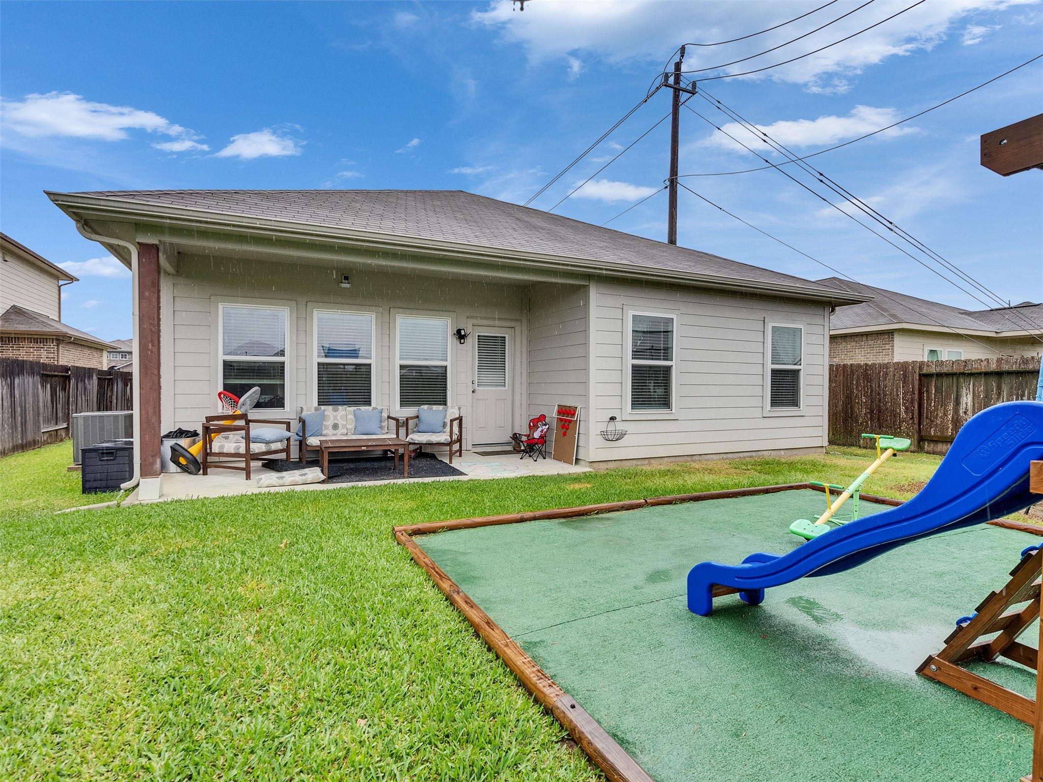 8719 Willet Street Baytown, TX 77521 - Photo 42 of 42 a view of a house with swimming pool and porch