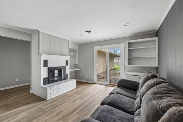 a bedroom with a bed and a fireplace