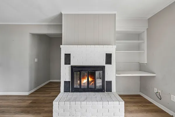 a bedroom with a bed and a fireplace