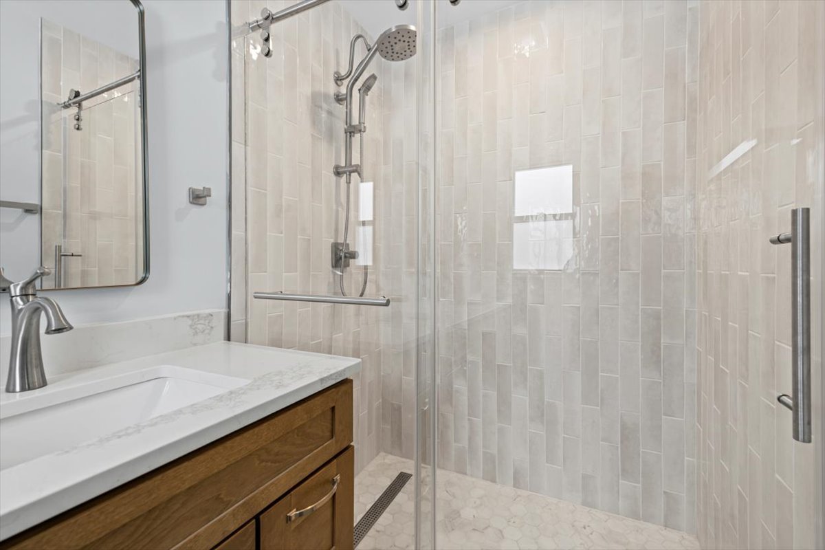 2527 Checker Road Long Grove, IL 60047 - Photo 22 of 32 a bathroom with a sink and a mirror
