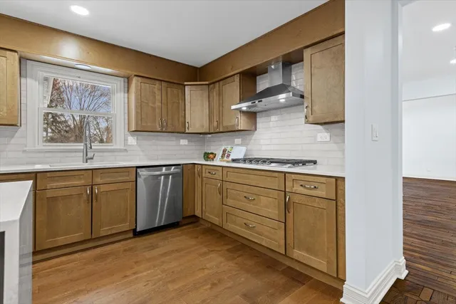 a kitchen with cabinets a sink and appliances