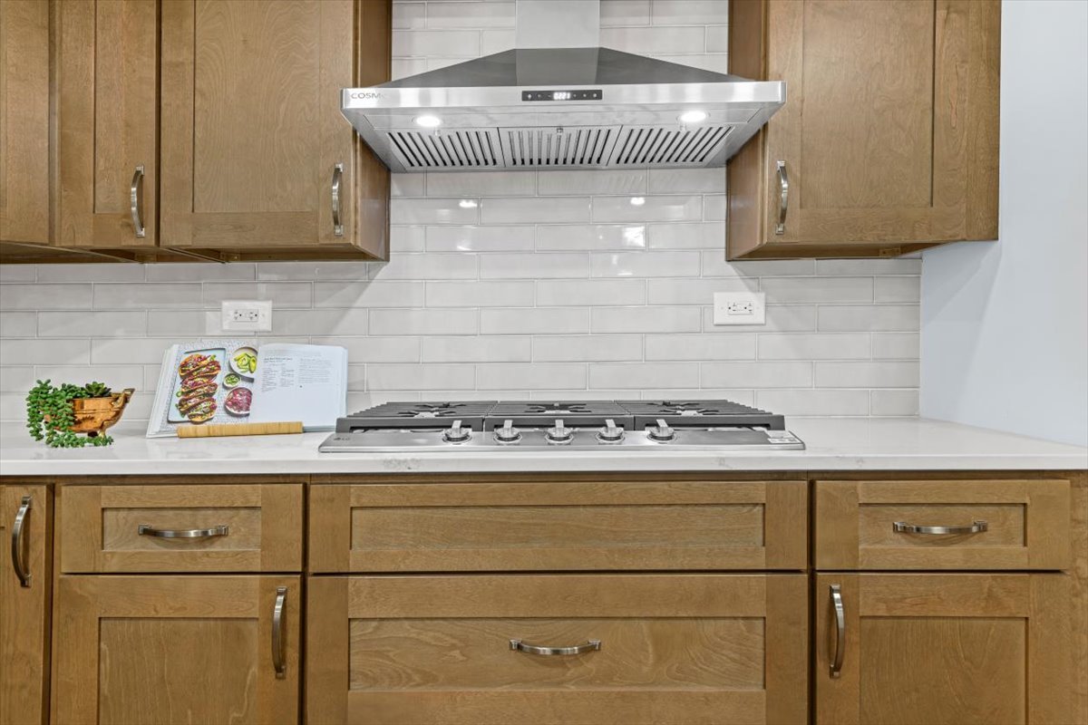 2527 Checker Road Long Grove, IL 60047 - Photo 7 of 32 a kitchen with a stove and cabinets