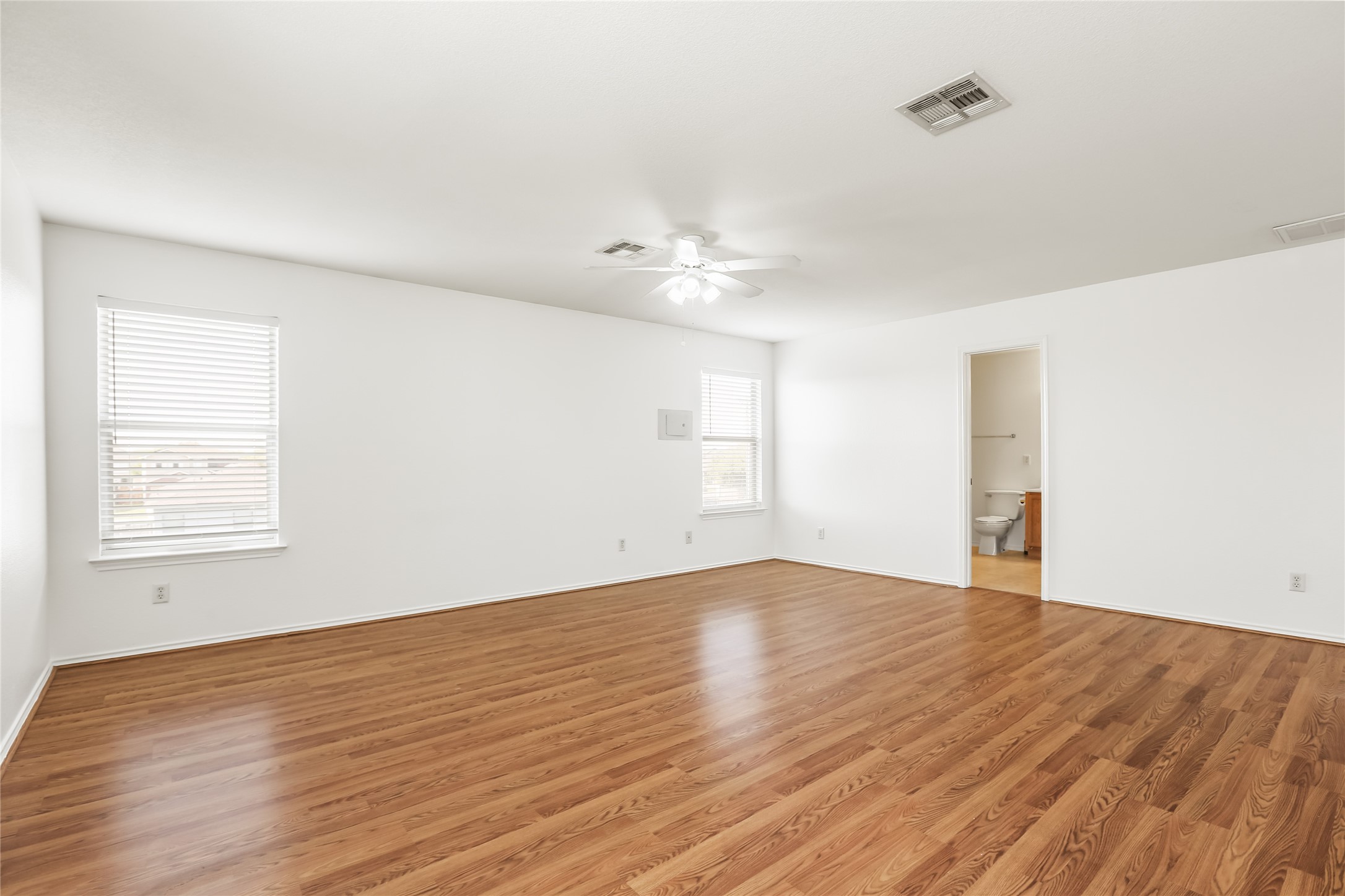 2010 Ashberry Trail Georgetown, TX 78626 - Photo 13 of 24 Unfurnished room featuring a ceiling fan and light wood finished floors