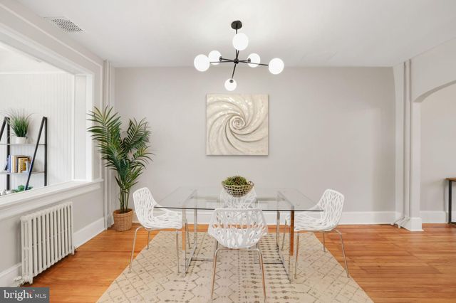 a kitchen with stainless steel appliances a refrigerator sink and cabinets