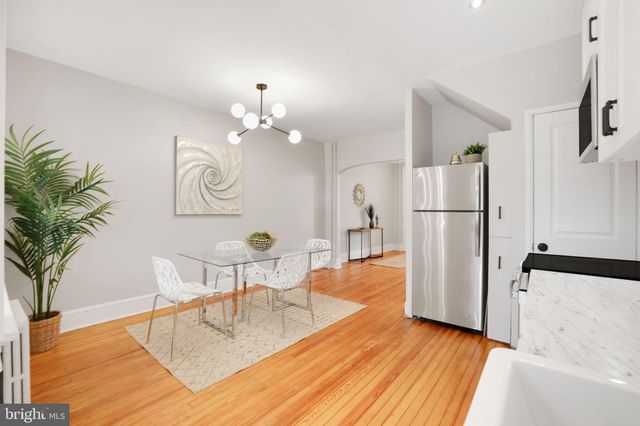 a living room with fireplace furniture and a flat screen tv