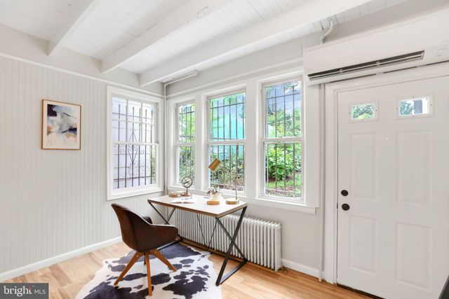 a bedroom with bed and window