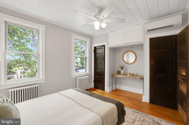 a bedroom with a bed and dresser