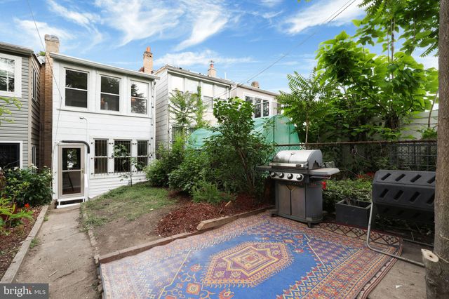 a view of a large building with a yard