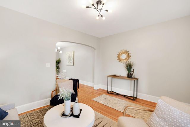 a view of a room with wooden floor and staircase