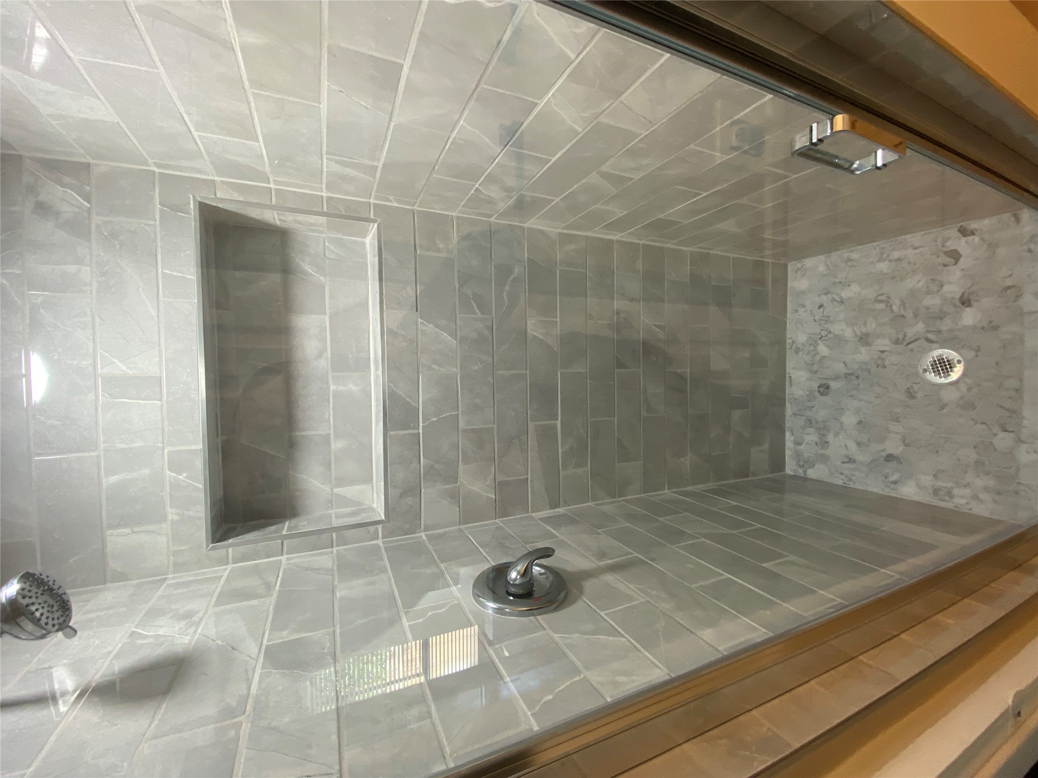 3010 Fruth Street, Unit B Austin, TX 78705 - Photo 30 of 32 A well-appointed shower features elegant tile work and a convenient built-in niche.