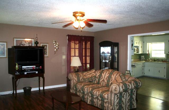 The living room is semi opened to the Country Kitchen.