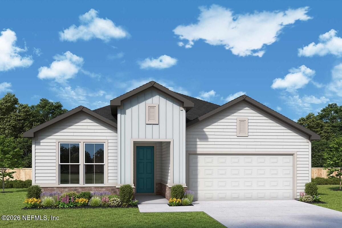 75655 Bayley Place Yulee, FL 32097 - Photo 1 of 1 a front view of a house with a yard and garage