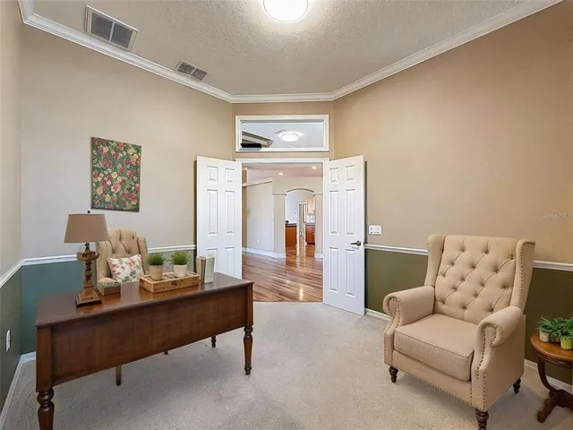 a living room with furniture and a table