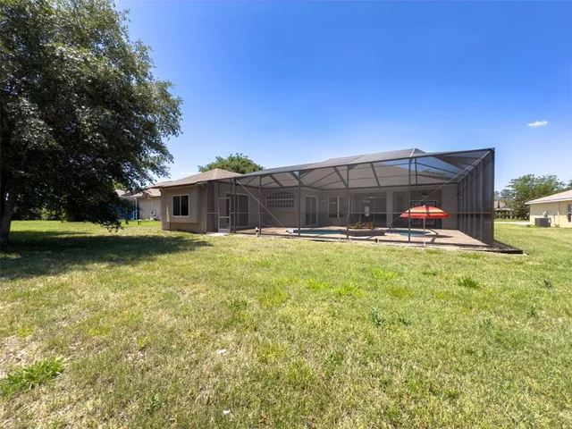 a view of swimming pool with a yard