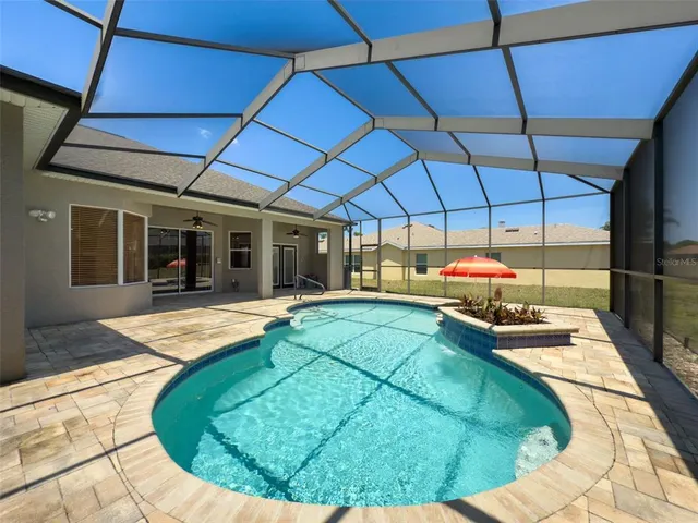 a view of a house with a swimming pool