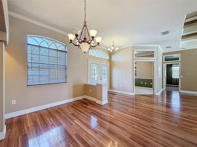 a view of livingroom with window wooden floor and front door